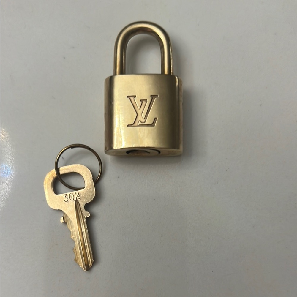 Authentic Louis Vuitton Gold Padlock with Key